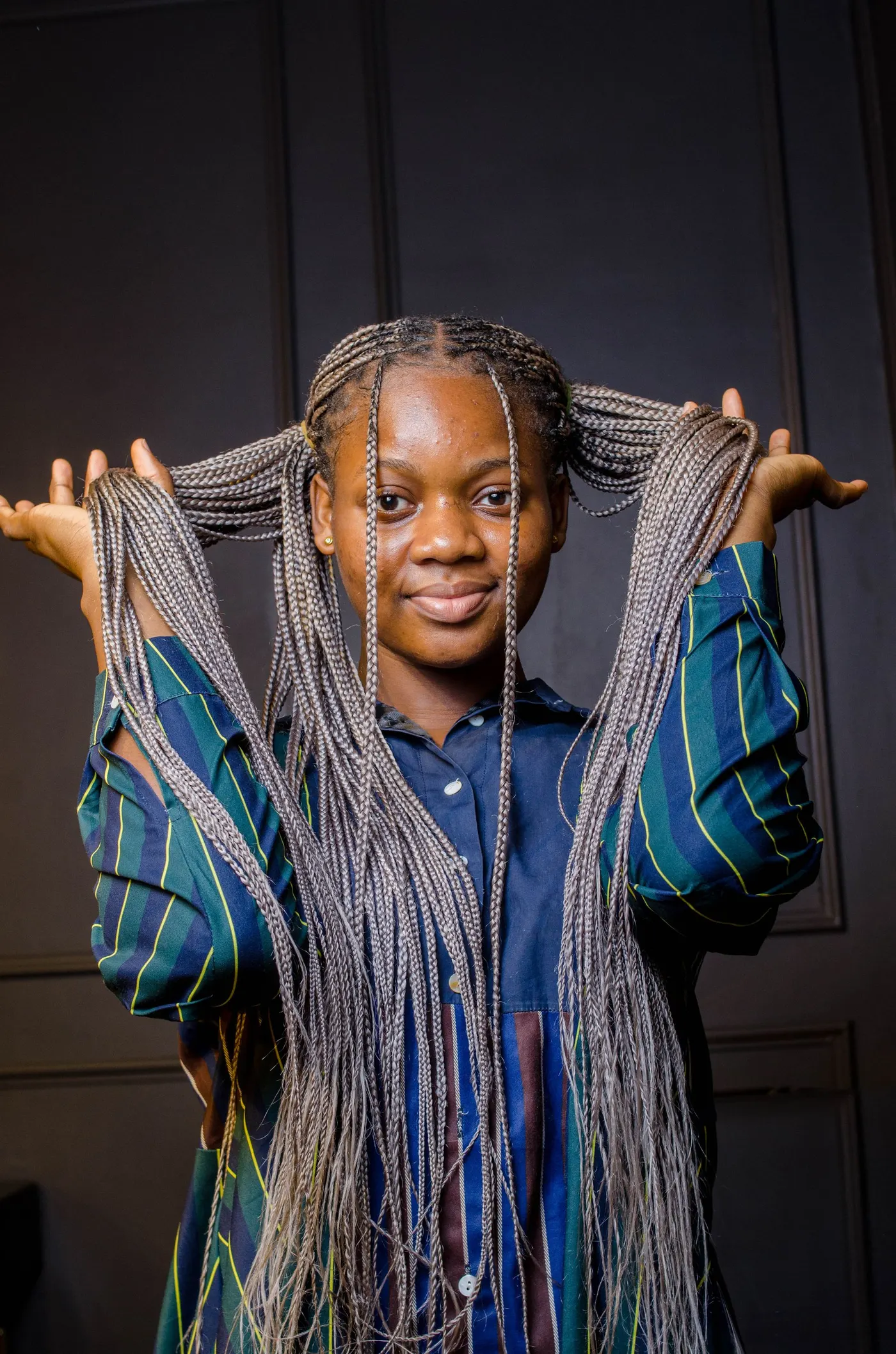 Joyful client showing off a finished braided style