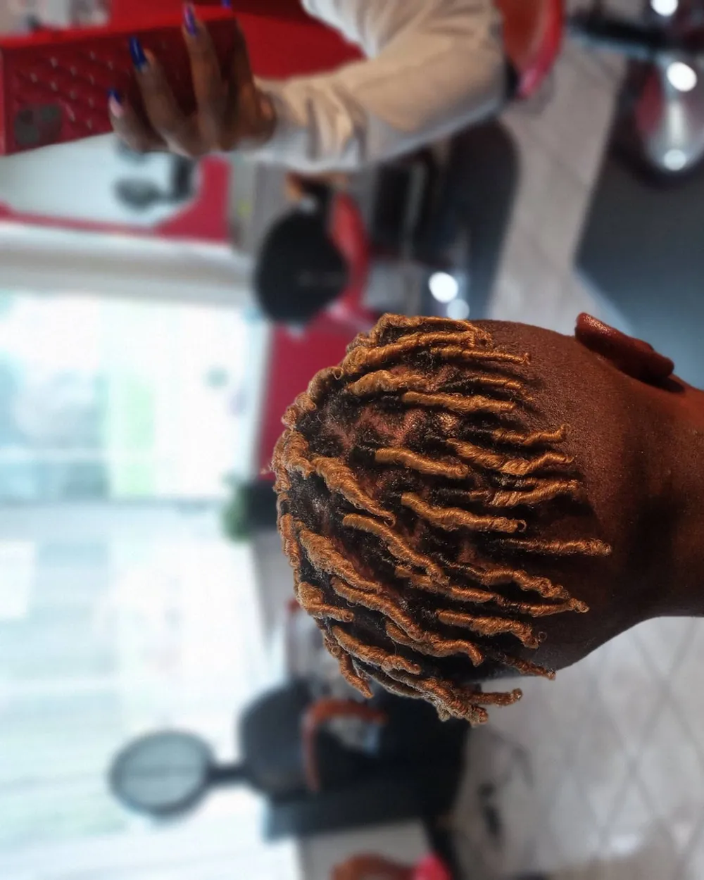 Freeform dreads with color detail styled at Queenreal's Beauty Stop
