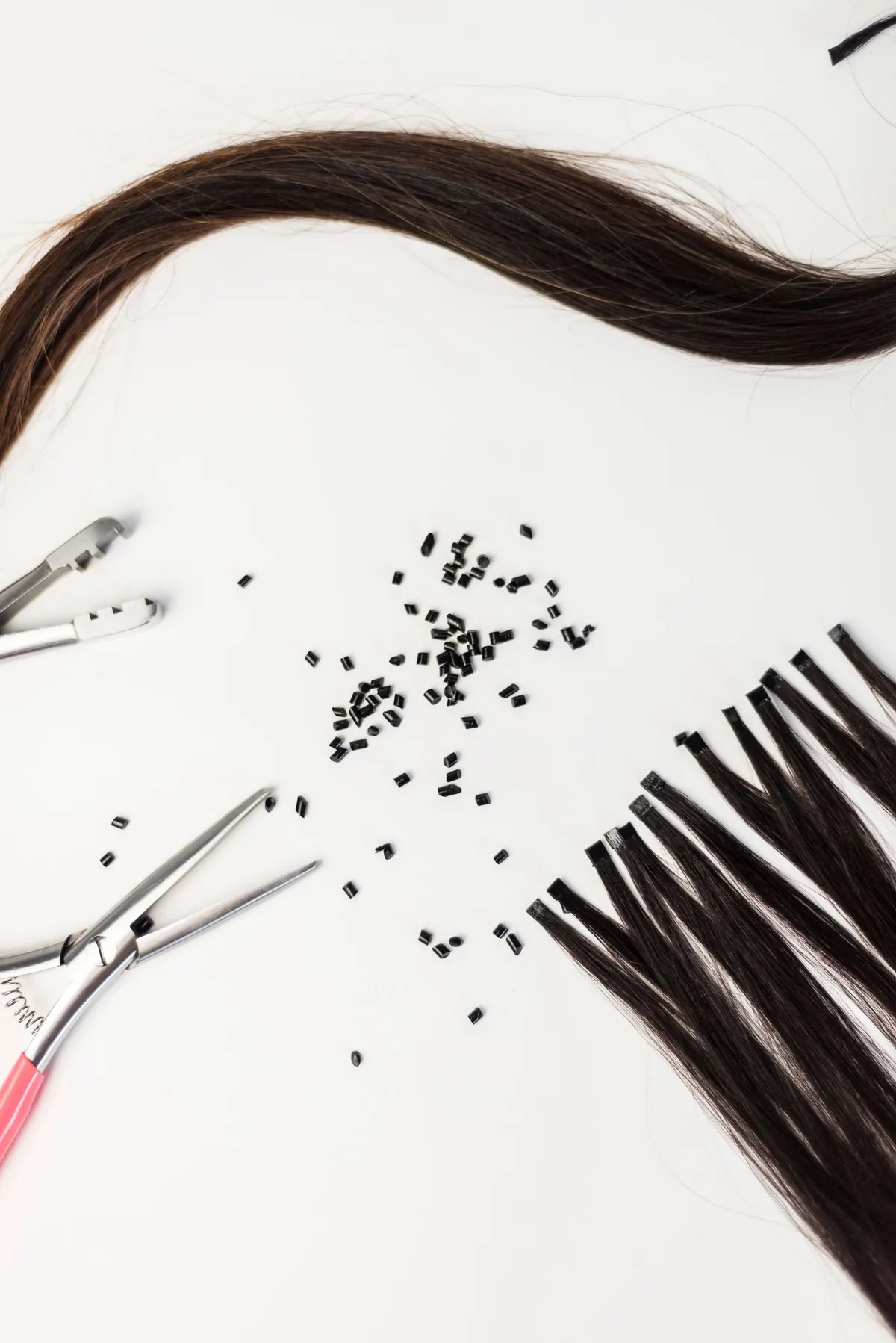 Styling tools and hair extensions flat lay
