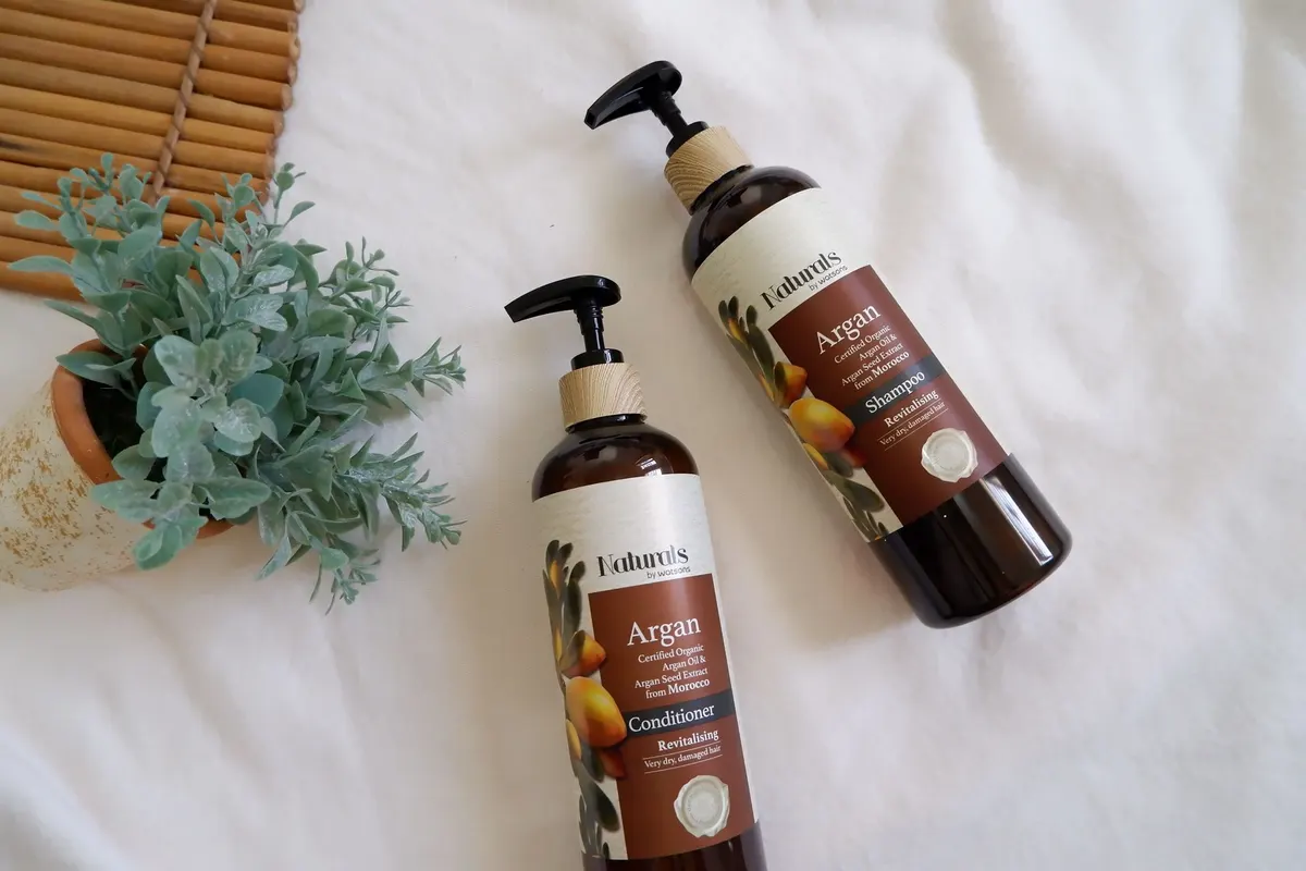 Hair care products arranged in an elegant flat lay